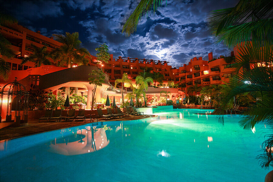Sheraton hotel swimming pool at twilight with moon shine